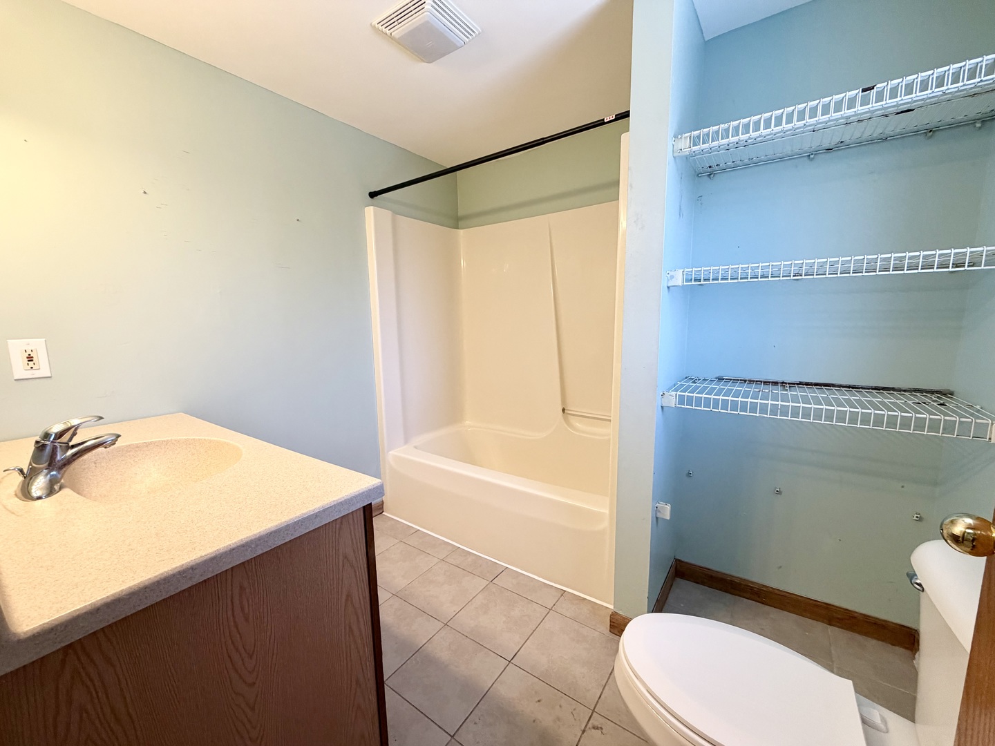 1429 Phelps Street Ottawa, IL 61350 - Photo 11 of 27 a bathroom with a sink toilet and shower