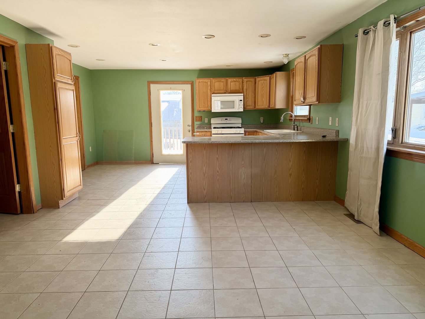 1429 Phelps Street Ottawa, IL 61350 - Photo 7 of 27 a kitchen with stainless steel appliances granite countertop a refrigerator and a sink