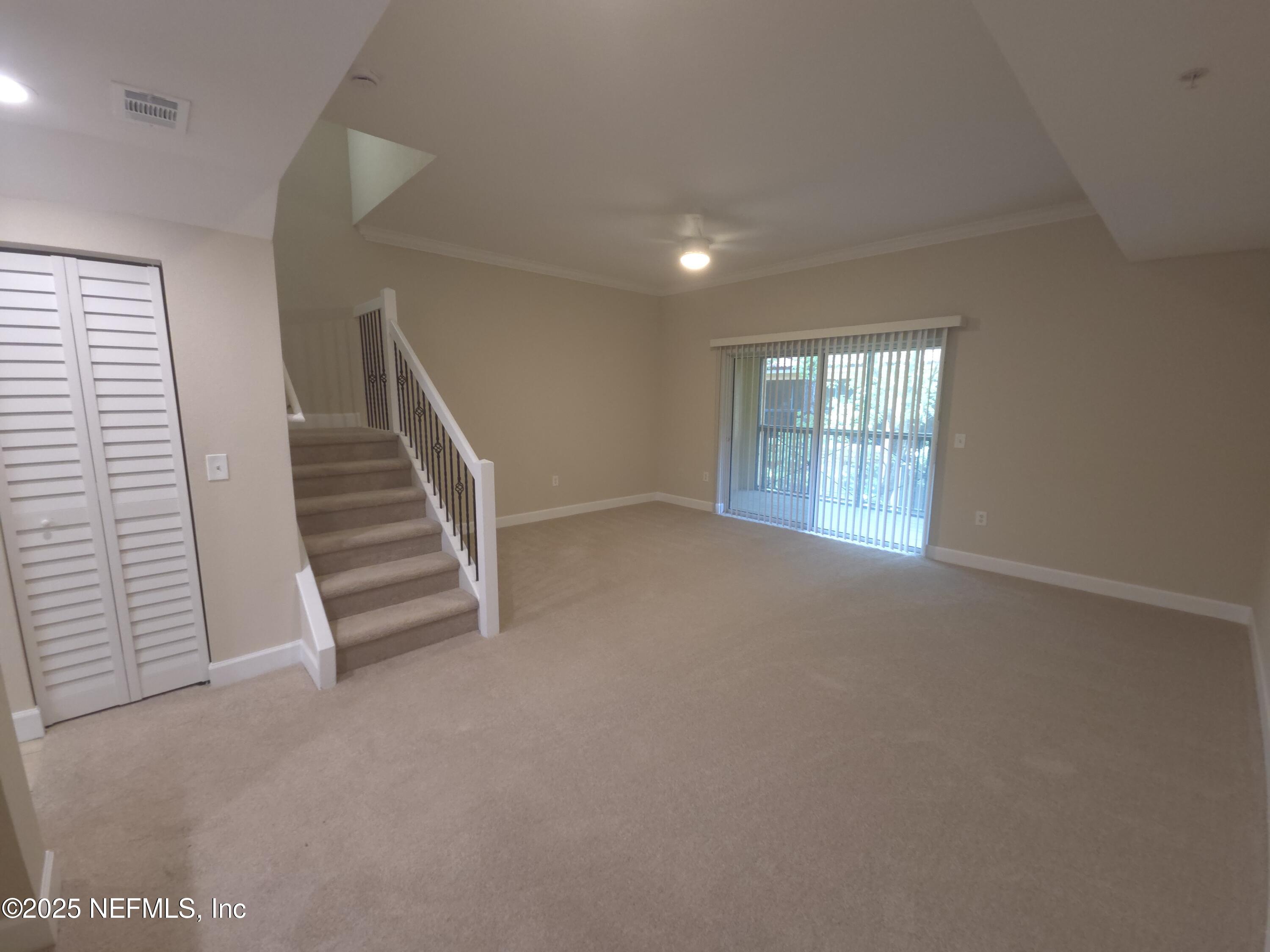 9745 Touchton Road, Unit 427 Jacksonville, FL 32246 - Photo 12 of 52 an empty room with windows