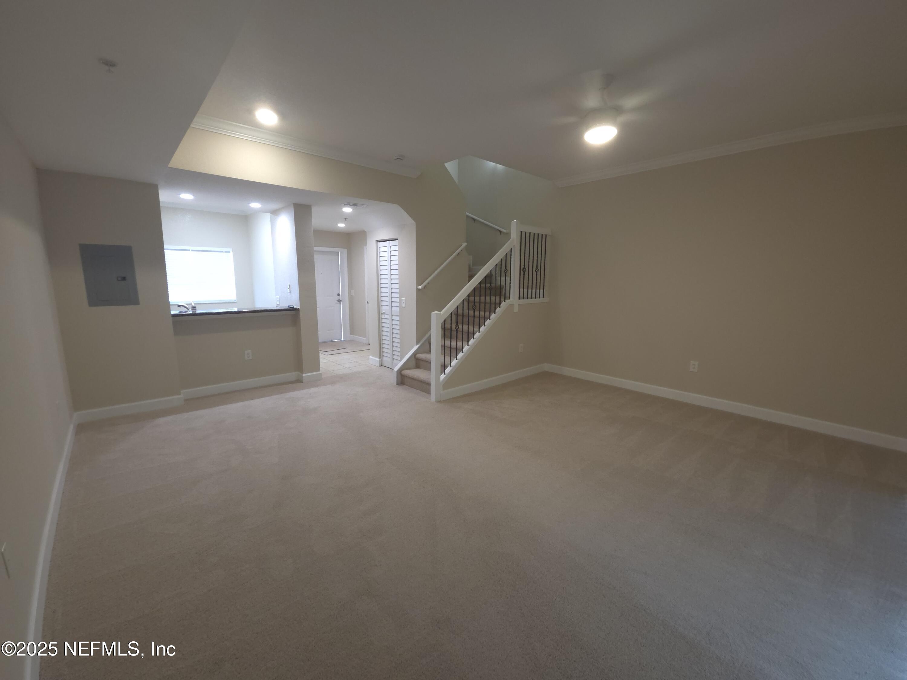 9745 Touchton Road, Unit 427 Jacksonville, FL 32246 - Photo 13 of 52 an empty room with windows