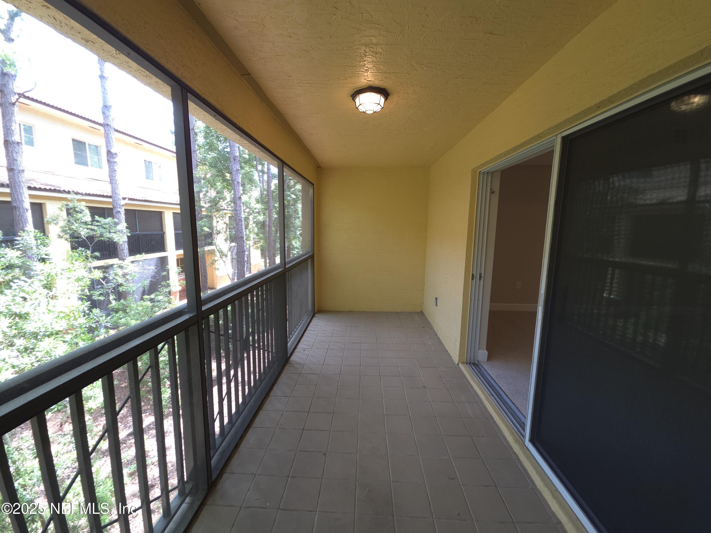 9745 Touchton Road, Unit 427 Jacksonville, FL 32246 - Photo 17 of 52 a view of a hallway