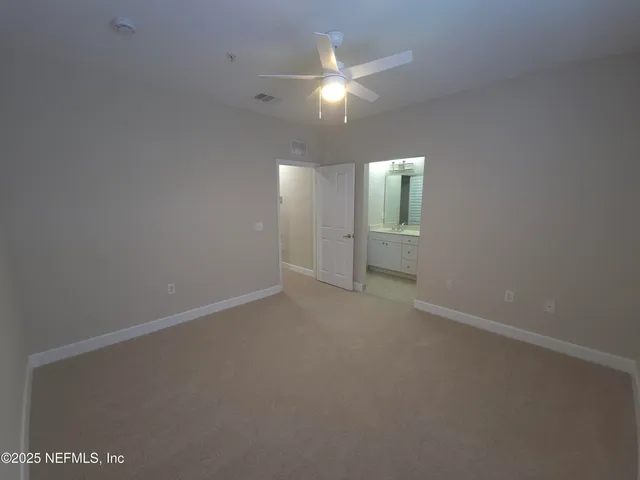 a bedroom with bed and a couch