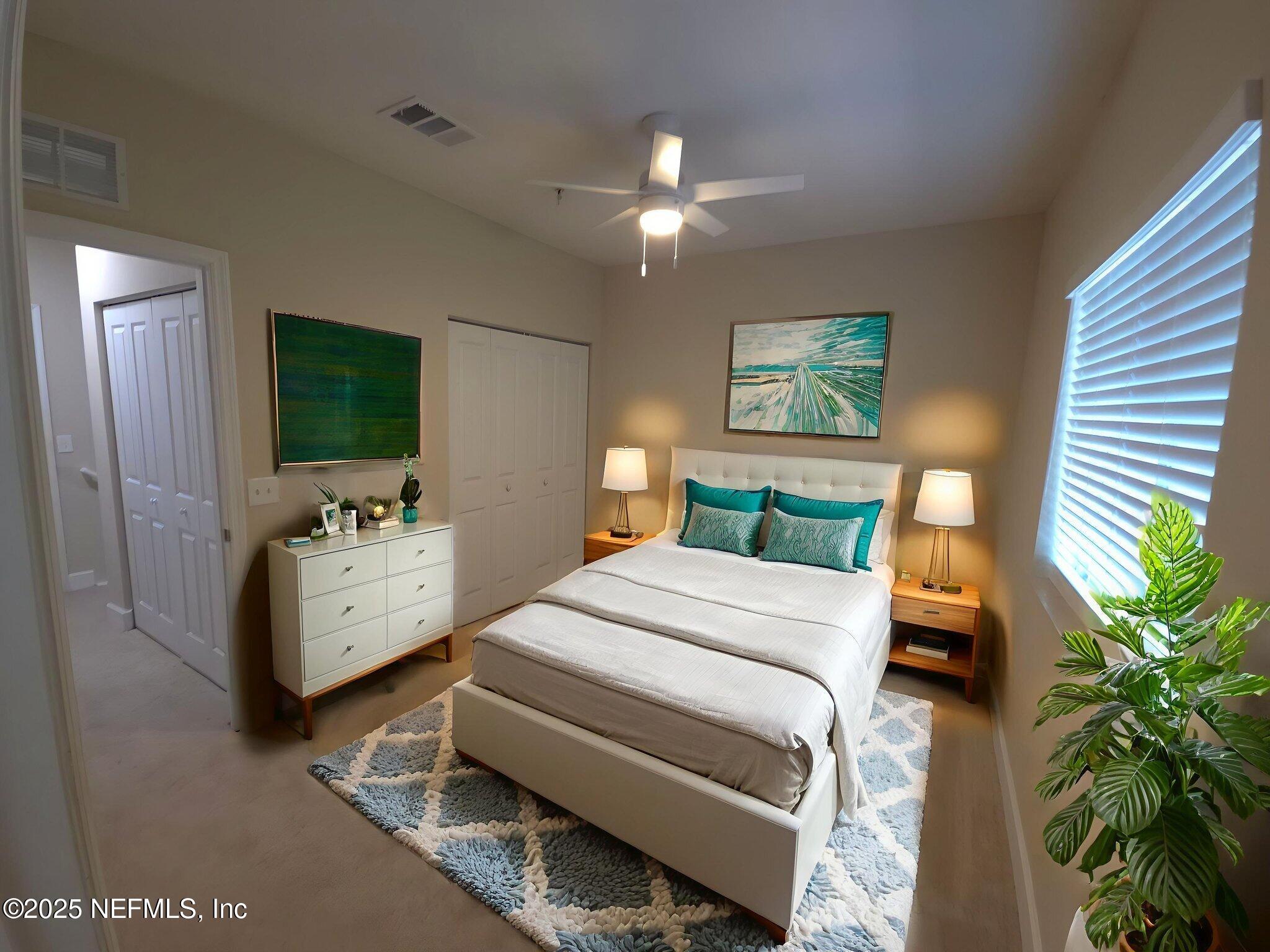 9745 Touchton Road, Unit 427 Jacksonville, FL 32246 - Photo 30 of 52 a bedroom with a bed and a couch