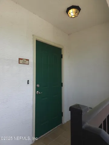 a view of hallway with windows