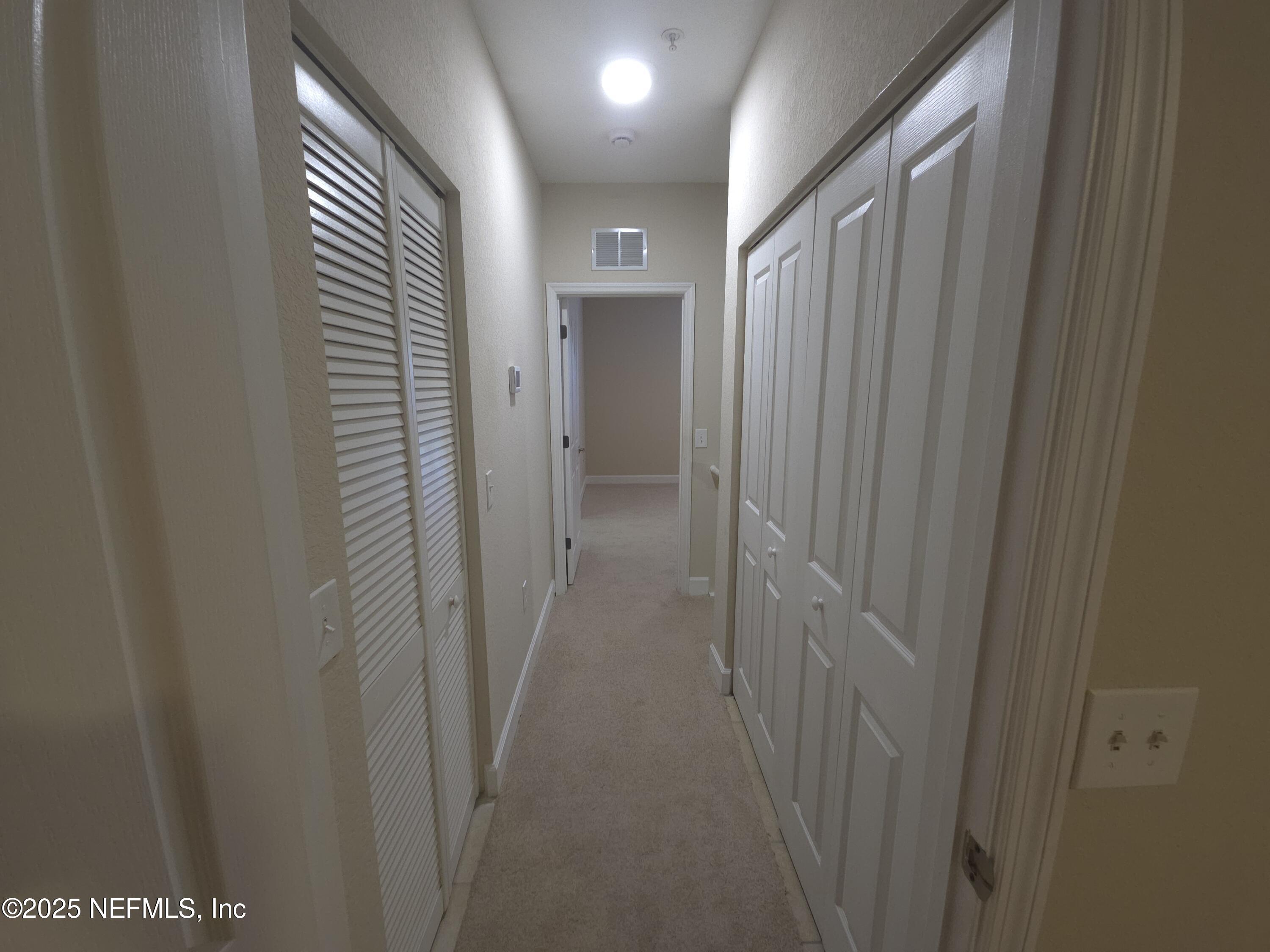9745 Touchton Road, Unit 427 Jacksonville, FL 32246 - Photo 32 of 52 a view of a hallway