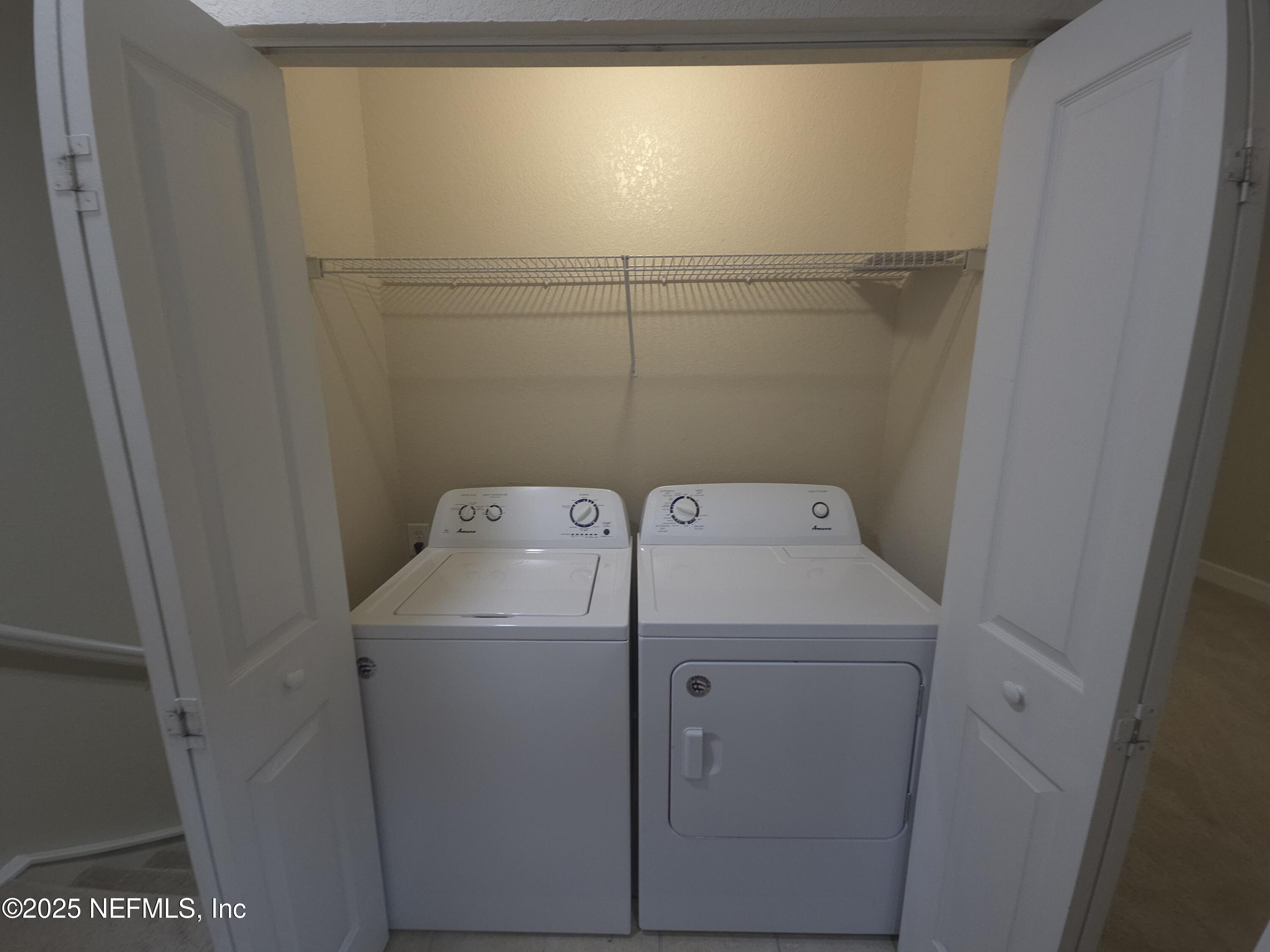 9745 Touchton Road, Unit 427 Jacksonville, FL 32246 - Photo 34 of 52 a utility room with dryer and washer