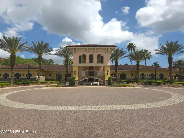 a lobby with furniture and a rug