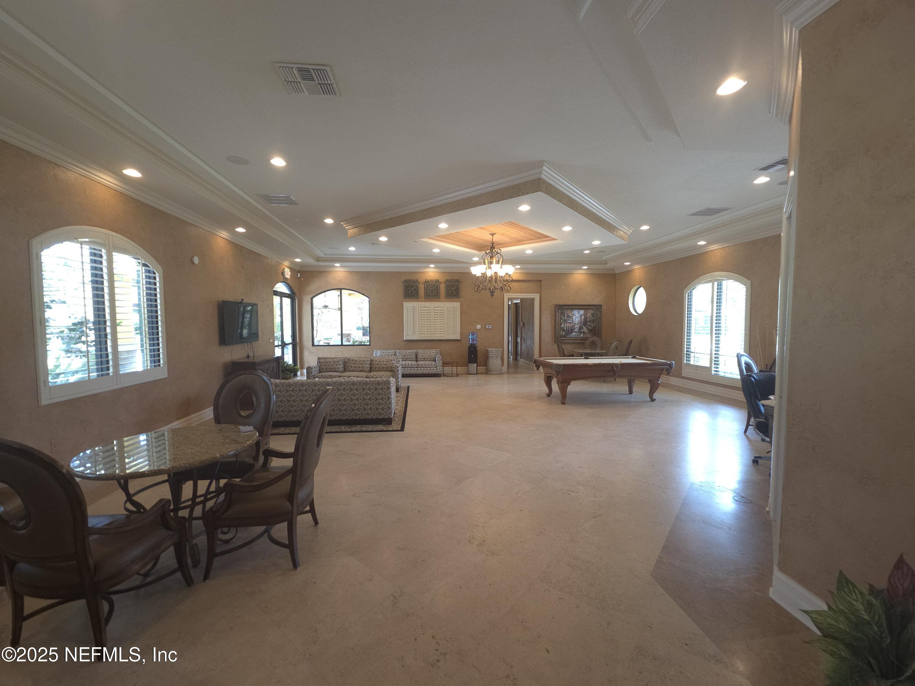 9745 Touchton Road, Unit 427 Jacksonville, FL 32246 - Photo 38 of 52 a lobby with furniture and a rug