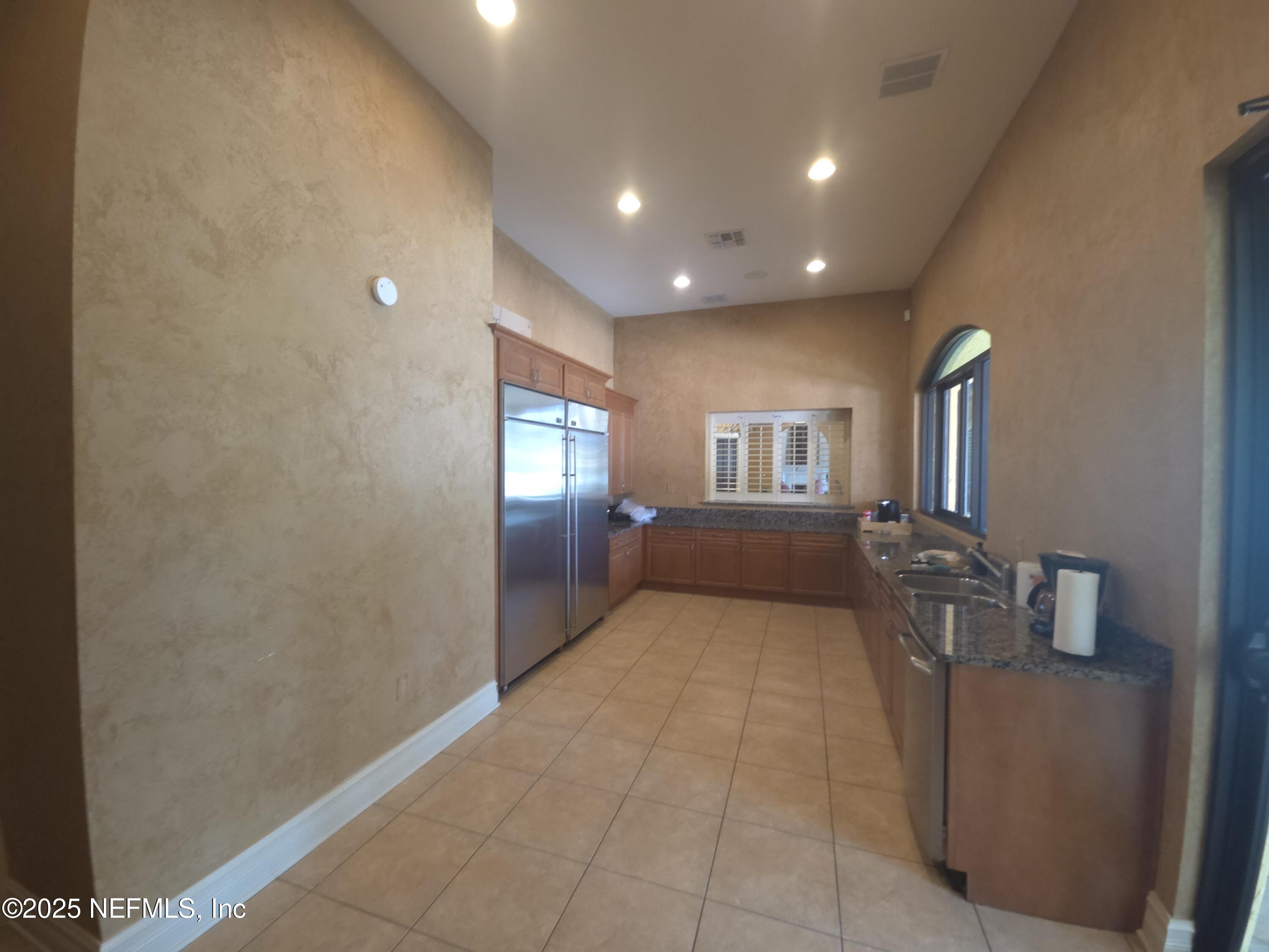 9745 Touchton Road, Unit 427 Jacksonville, FL 32246 - Photo 41 of 52 a view of a livingroom with furniture and windows