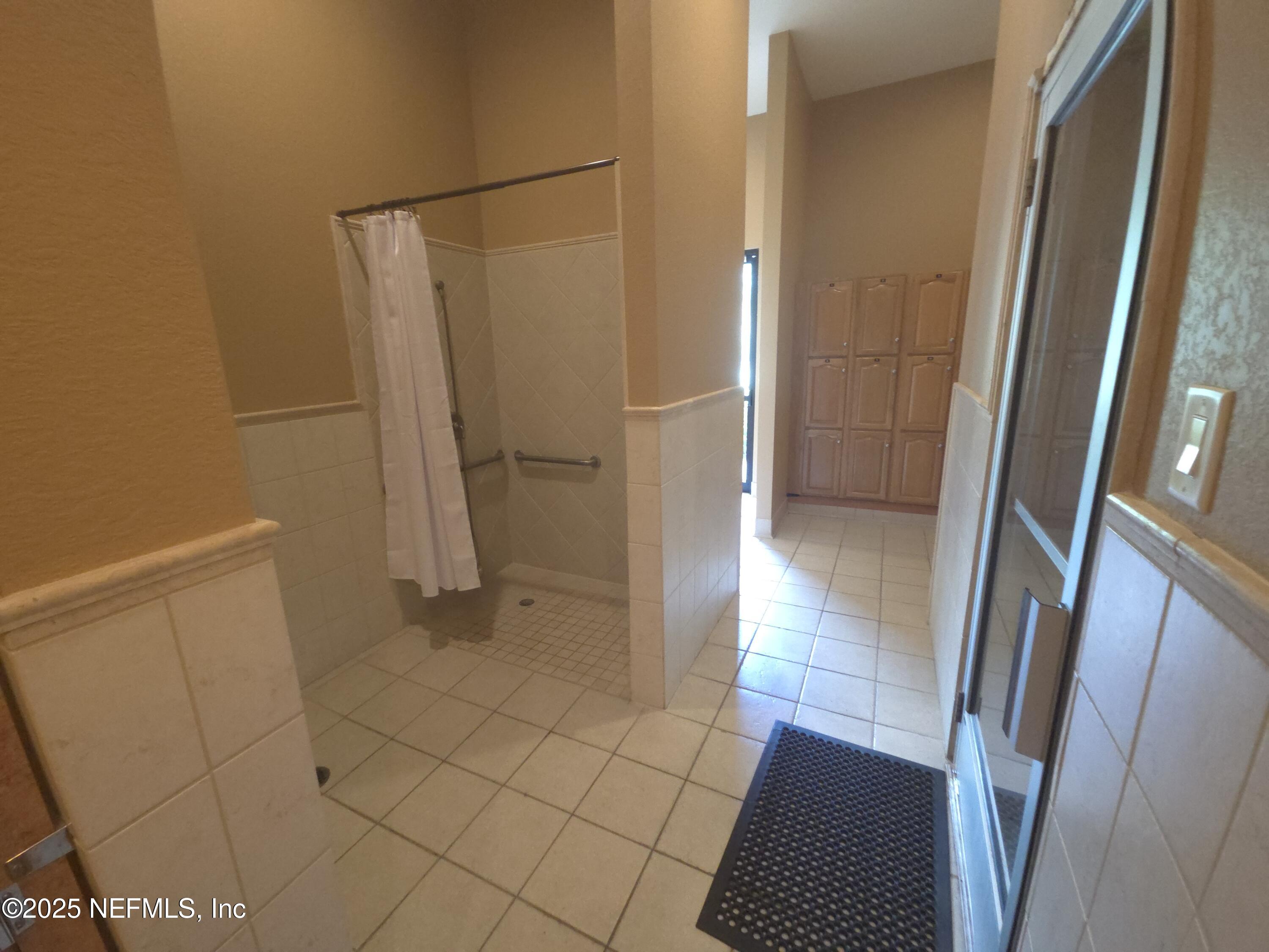 9745 Touchton Road, Unit 427 Jacksonville, FL 32246 - Photo 47 of 52 a bathroom with a sink and a shower