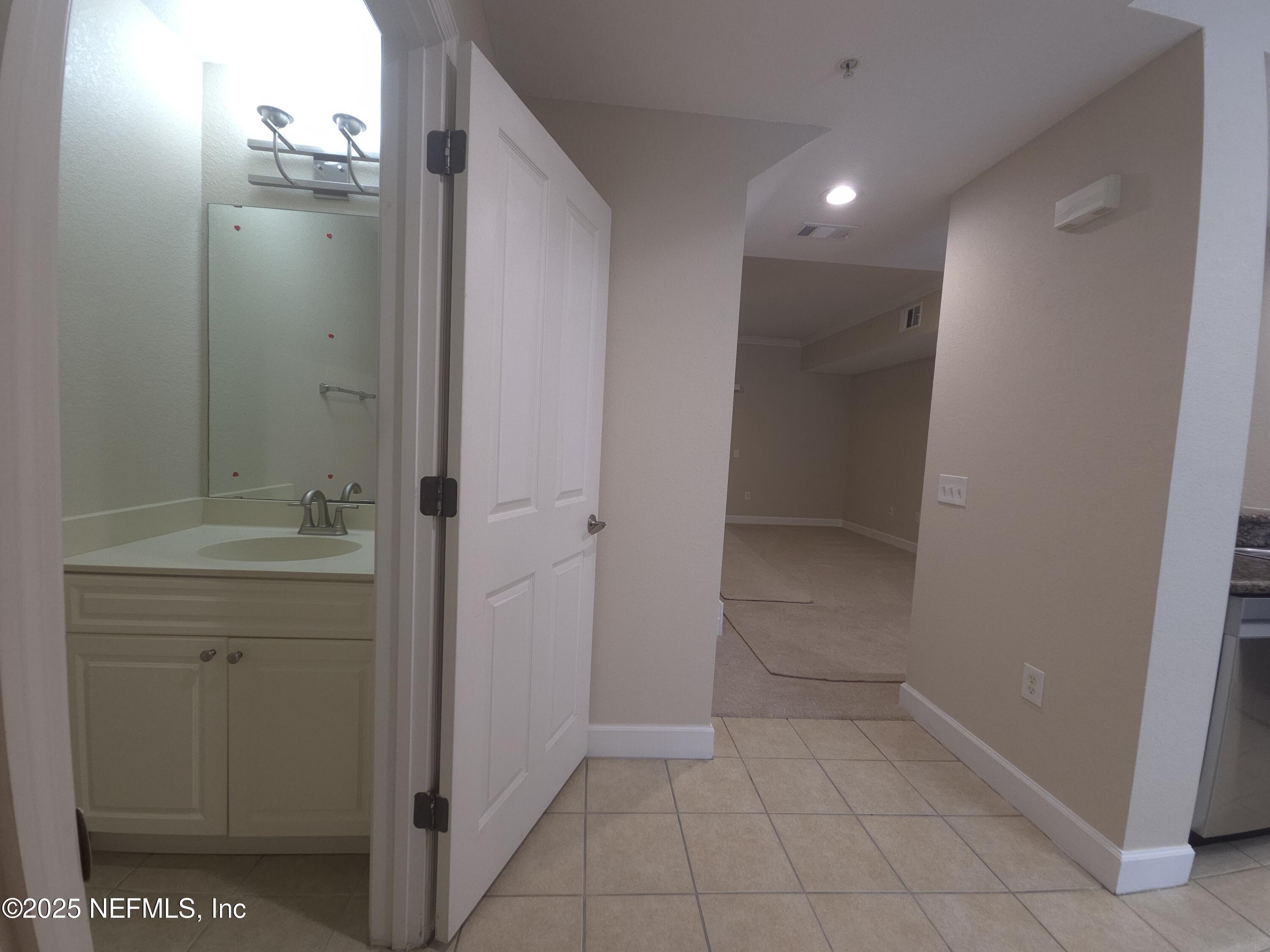 9745 Touchton Road, Unit 427 Jacksonville, FL 32246 - Photo 5 of 52 a bathroom with a shower and a sink