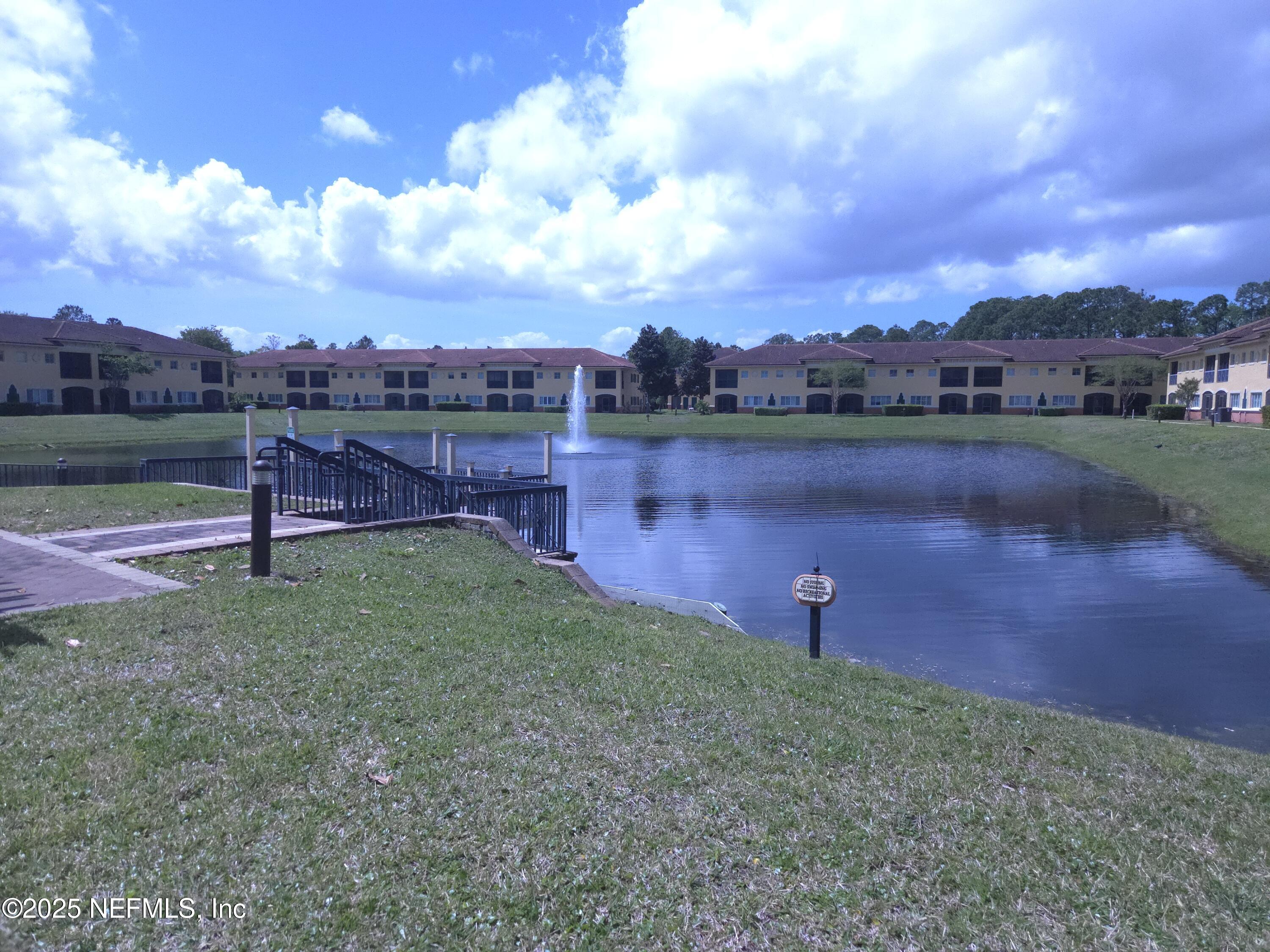 9745 Touchton Road, Unit 427 Jacksonville, FL 32246 - Photo 52 of 52 a view of a lake with houses in the back