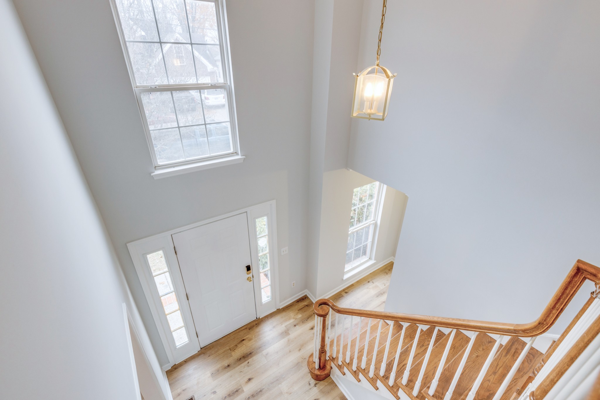 2829 Rader Ridge Court Antioch, TN 37013 - Photo 16 of 35 an entryway with wooden floor and staircase