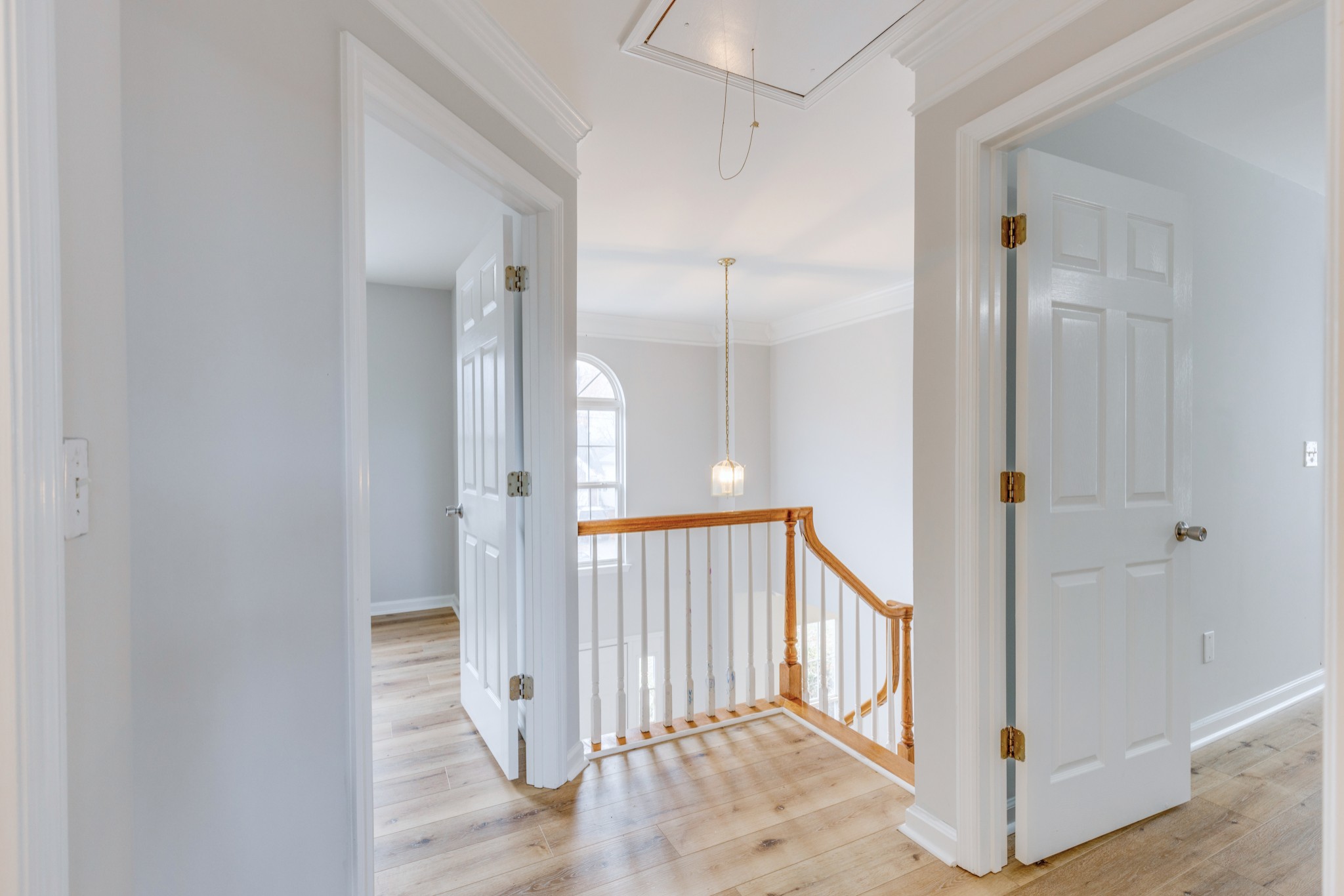2829 Rader Ridge Court Antioch, TN 37013 - Photo 17 of 35 a view of a hallway with wooden floor and staircase