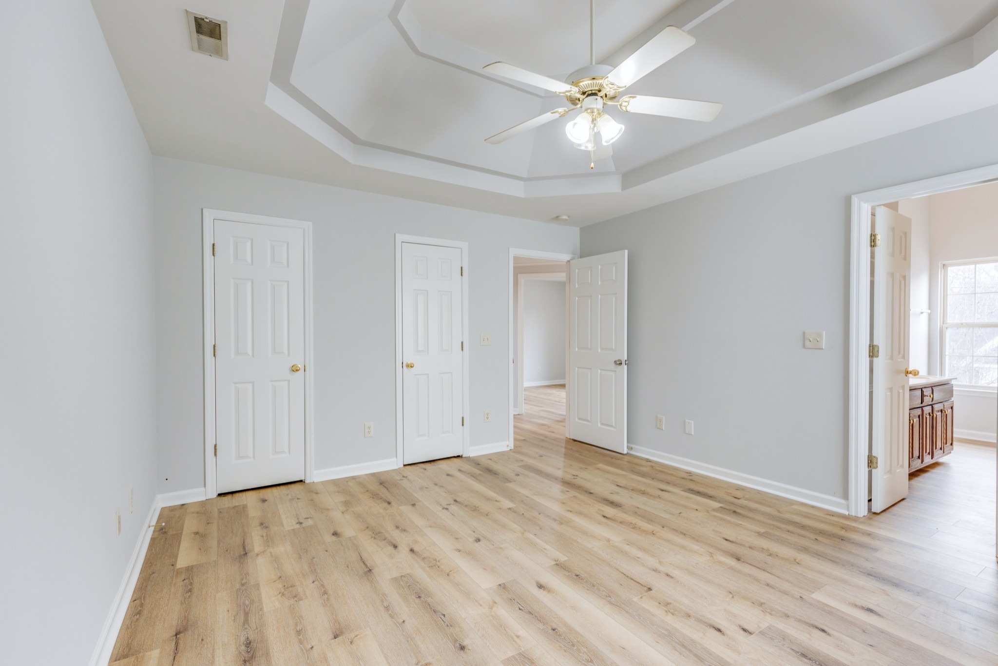 2829 Rader Ridge Court Antioch, TN 37013 - Photo 20 of 35 wooden floor in an empty room with a ceiling fan