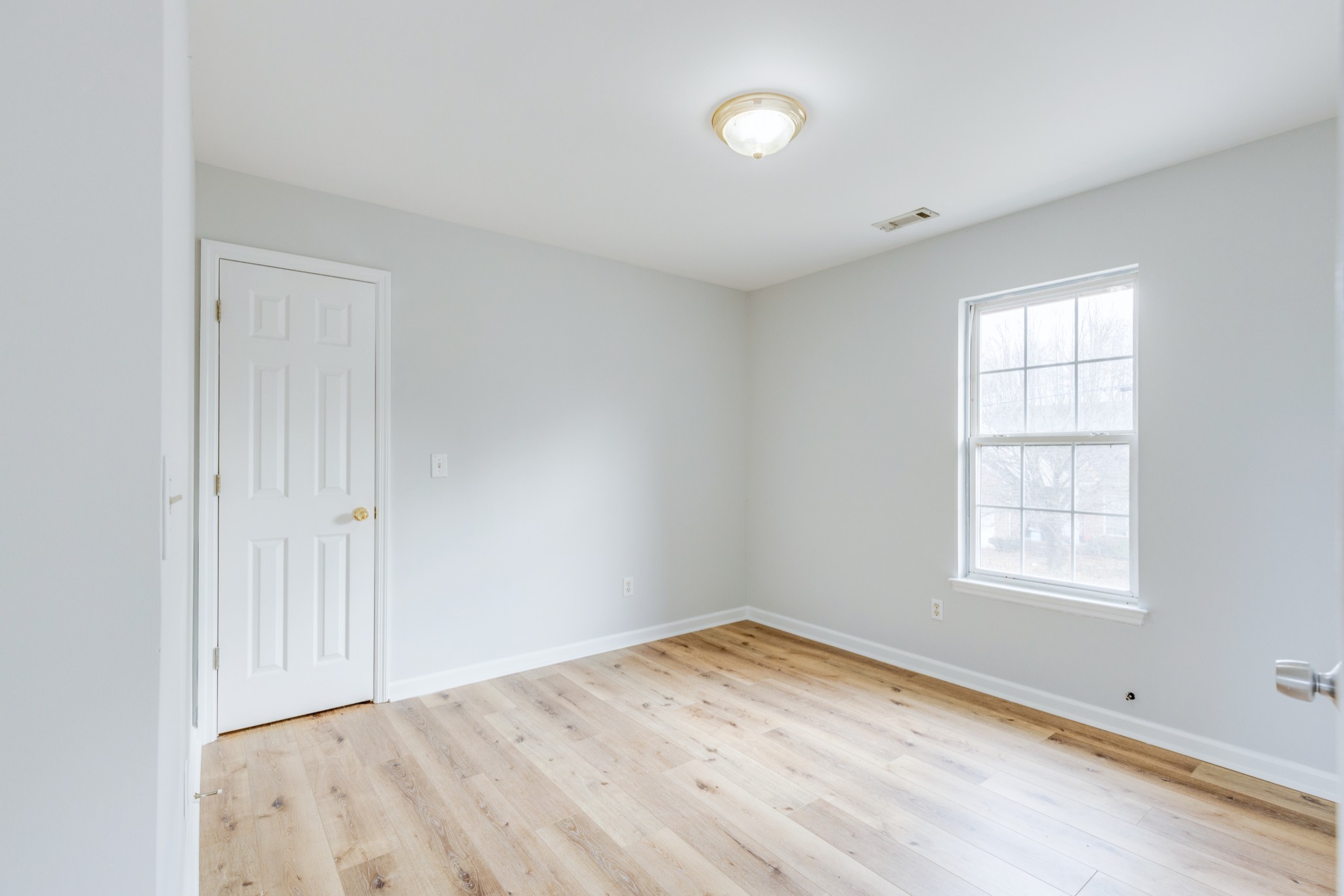 2829 Rader Ridge Court Antioch, TN 37013 - Photo 23 of 35 an empty room with wooden floor and windows