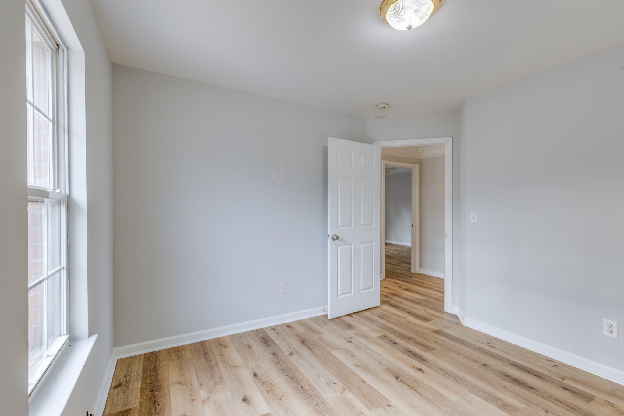 2829 Rader Ridge Court Antioch, TN 37013 - Photo 24 of 35 a view of an empty room with wooden floor and a window