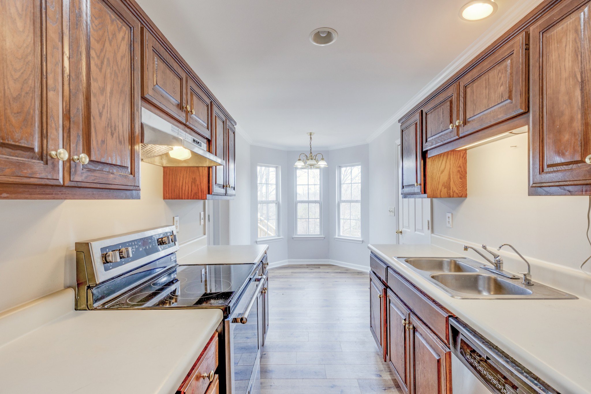 2829 Rader Ridge Court Antioch, TN 37013 - Photo 9 of 35 a kitchen with a sink stove and cabinets