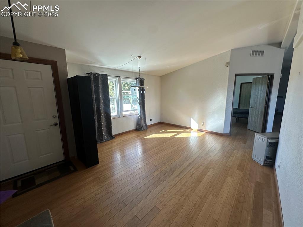 33171 Elk Park Road Trinidad, CO 81082 - Photo 2 of 21 wooden floor in an empty room with a window