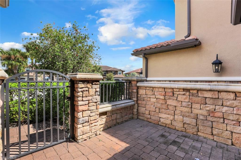 8776 Bellano Court, Unit 104 Naples, FL 34119 - Photo 14 of 34 a view of a terrace with trees