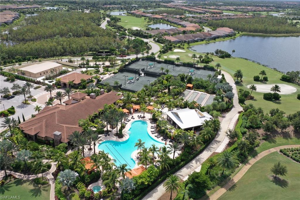 8776 Bellano Court, Unit 104 Naples, FL 34119 - Photo 25 of 34 an aerial view of residential houses with outdoor space