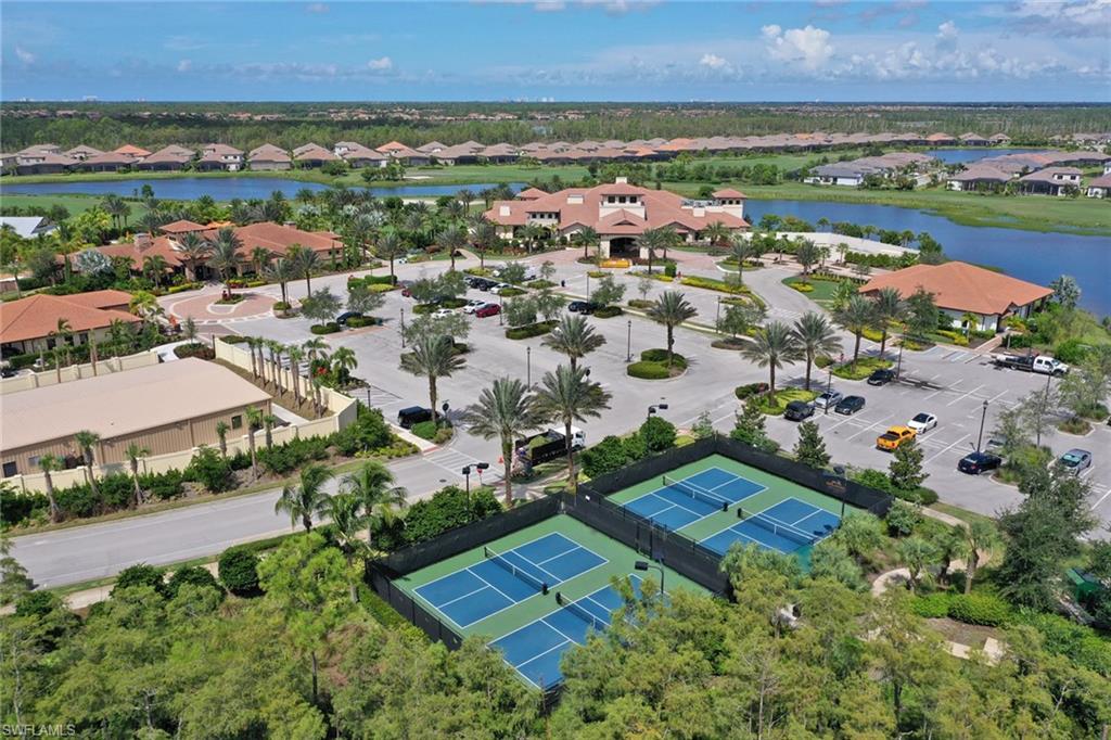 8776 Bellano Court, Unit 104 Naples, FL 34119 - Photo 27 of 34 an aerial view of residential houses with outdoor space