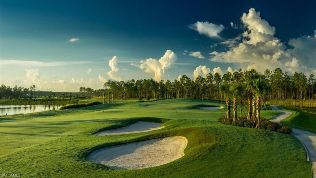 8776 Bellano Court, Unit 104 Naples, FL 34119 - Photo 30 of 34 a view of a golf course with a lake view