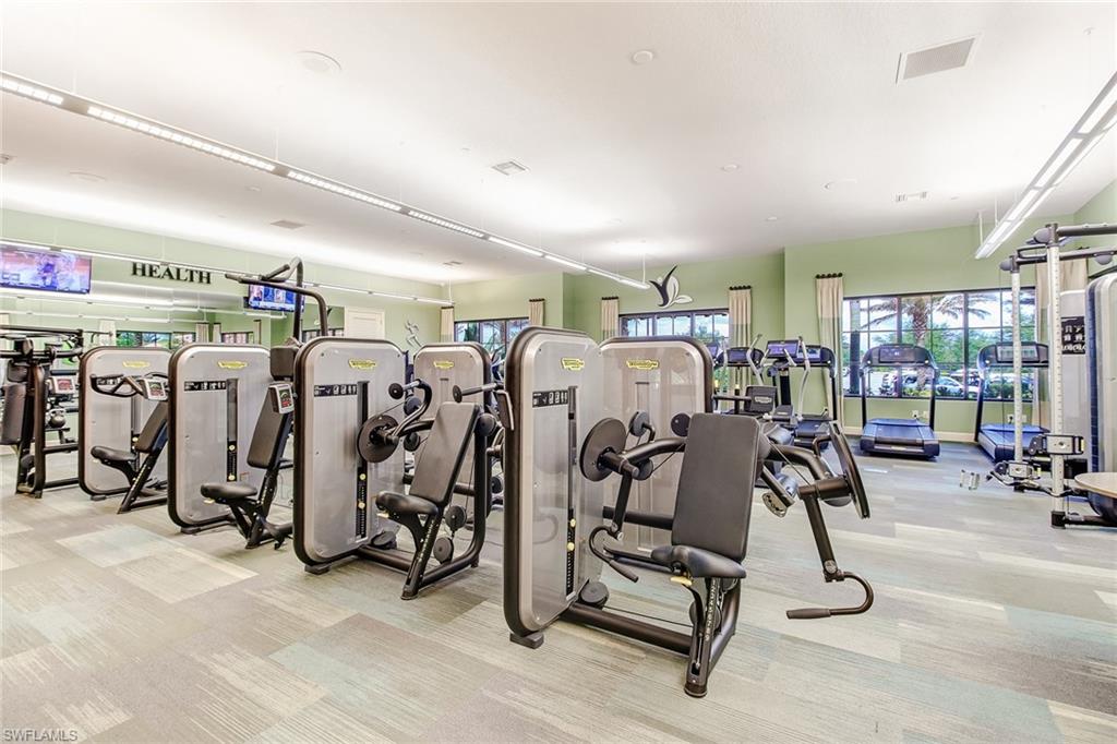 8776 Bellano Court, Unit 104 Naples, FL 34119 - Photo 31 of 34 a view of a room with gym equipment