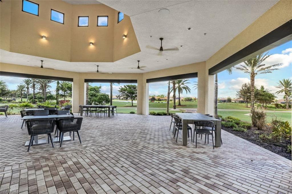 8776 Bellano Court, Unit 104 Naples, FL 34119 - Photo 34 of 34 a view of a patio with table and chairs