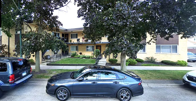 a car parked in front of a house