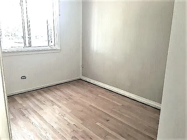 a view of a room that has a window