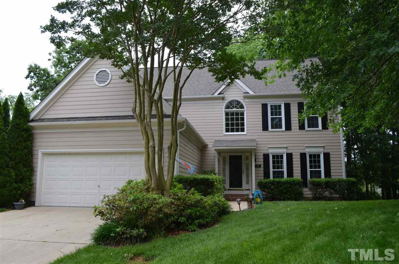 2108 Osprey Circle Raleigh, NC 27615 - Photo 1 of 15 a front view of a house with a garden and plants