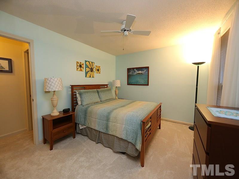2108 Osprey Circle Raleigh, NC 27615 - Photo 11 of 15 a bedroom with a bed and a flat screen tv