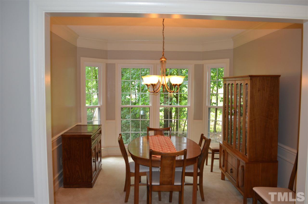 2108 Osprey Circle Raleigh, NC 27615 - Photo 3 of 15 a view of a dining room with furniture window and outside view