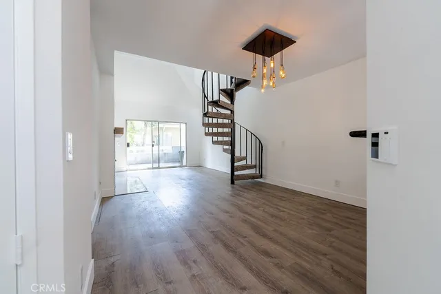 a bathroom with a granite countertop sink toilet a mirror a bathtub and shower