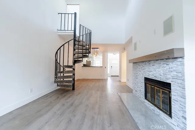 a view of a livingroom with a ceiling fan and window