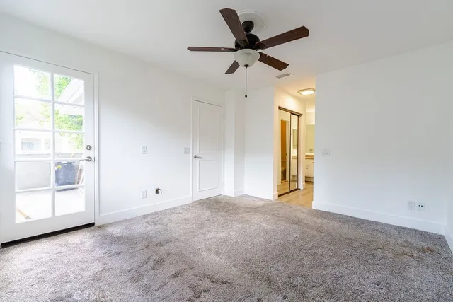 a view of an empty room and a window