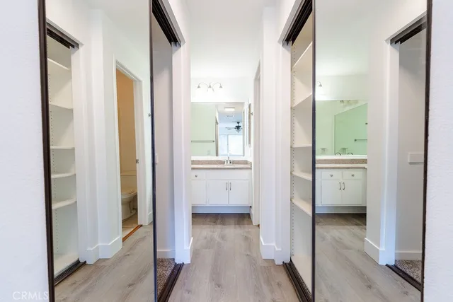 a view of bathroom with a sink and mirror