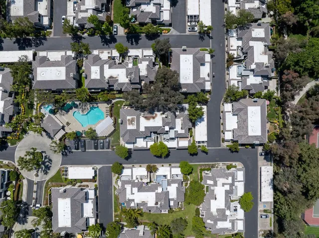 an aerial view of a house with yard