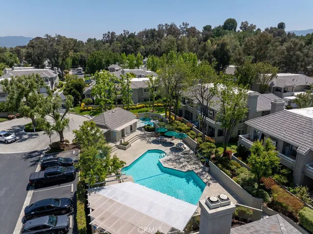 a view of a house with backyard porch and sitting area