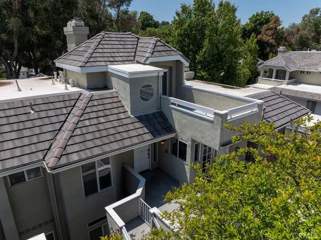 an aerial view of a house with outdoor space