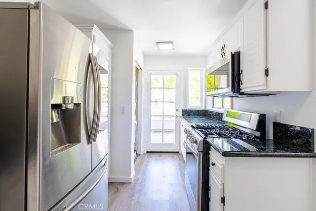 a close view of a utility room with washer and dryer