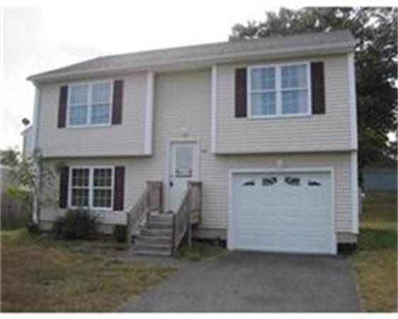 142 Pinevale Street Springfield, MA 01151 - Photo 1 of 2 a front view of a house with a yard