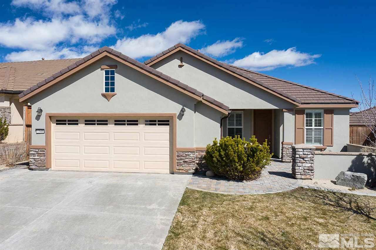 1540 Meridian Ranch Drive Reno, NV 89523 - Photo 1 of 25 a front view of a house with a yard and seating space