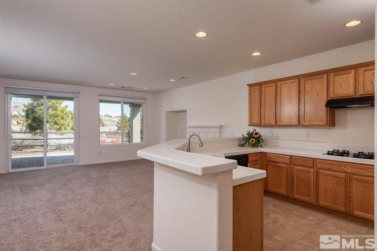 1540 Meridian Ranch Drive Reno, NV 89523 - Photo 12 of 25 a kitchen with sink a window and cabinets