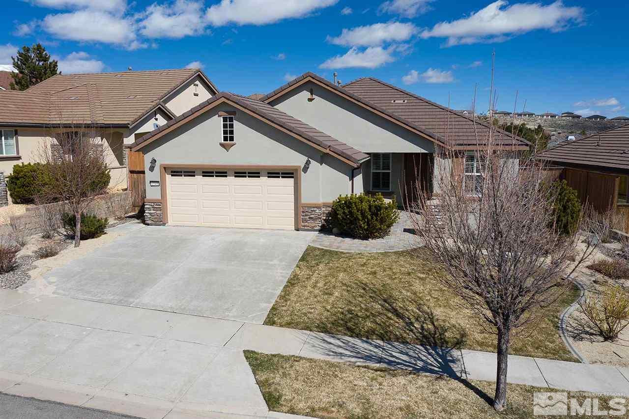 1540 Meridian Ranch Drive Reno, NV 89523 - Photo 3 of 25 a front view of a house with a yard and garage