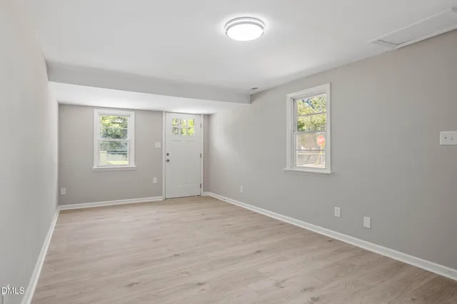 an empty room with windows