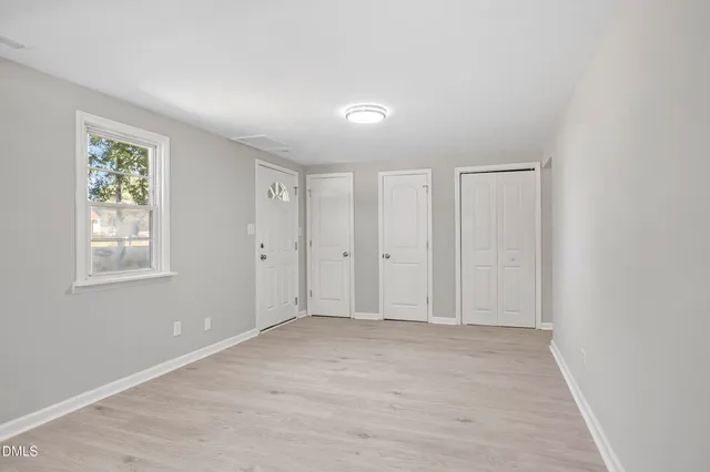 a view of an empty room with a window