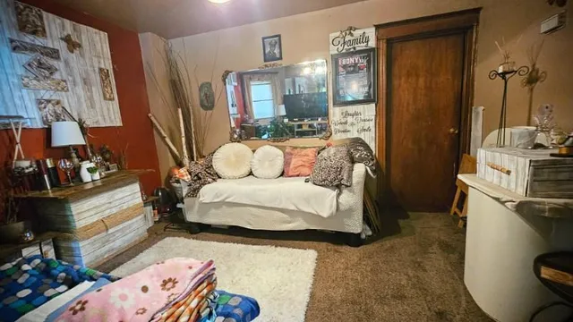 a bedroom with a bed and a mirror