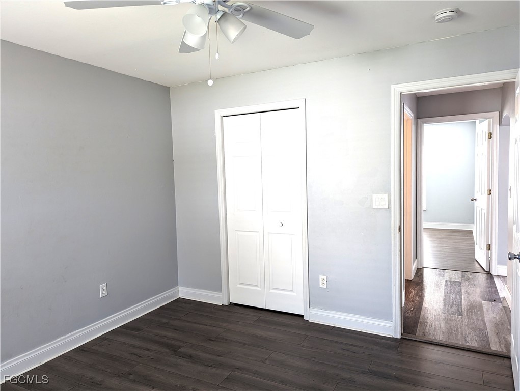 2311 Southwest 16th Terrace Cape Coral, FL 33991 - Photo 16 of 23 an empty room with wooden floor and windows